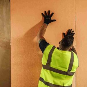 ISO-THERM insulation being installed on an internal wall