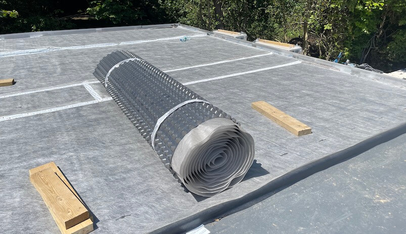 green roof membrane rolls on flat roof