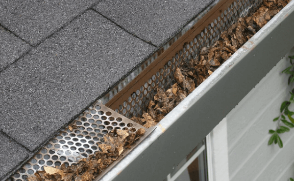 Leaves blocking house gutter