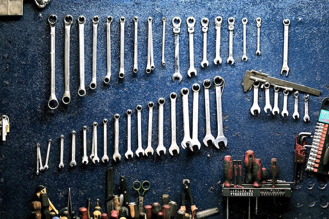 tools arranged on the wall of a man cave